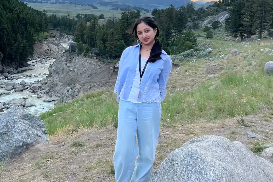 Zoha Waheed, the high school student who ran the physician shadowing survey, standing outdoors